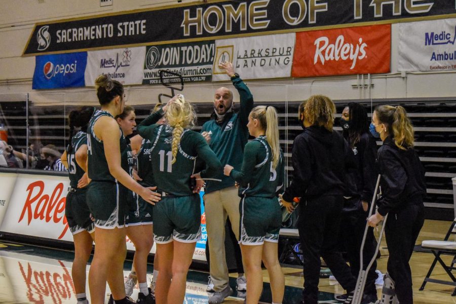 Coach Bunky Harkleroad discusses adjustments for the game to his players in the game against the University of Nevada at the Nest at Sac State Sunday, Dec. 13, 2020. Harkleroad said the team ultimately ran out of gas with only six available players.

