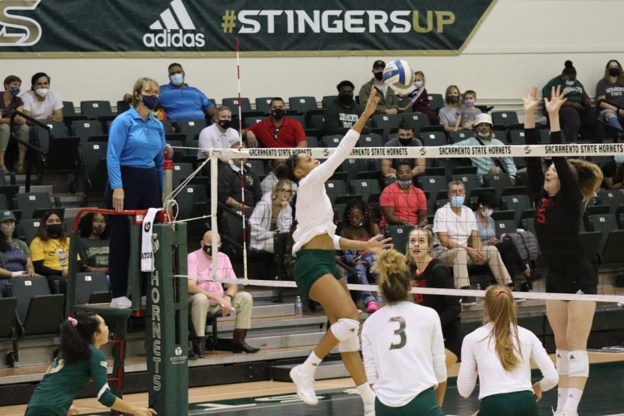 Senior middle blocker Cianna Andrews (2) flicks the ball over the net in an attempt to score against Southern Utah on Saturday, Oct. 9 2021. Andrews finished with four kills and six blocks in the win against the Thunderbirds.
