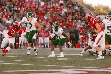 Senior Sacramento State football running back BJ Perkinson runs against Dixie State on Sept. 4, 2021. Perkinson finished the win against Dixie State with 98 total yards.