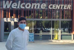 Third-year business administration major Felipe Carrillo stands in front of the Welcome Center on Sept. 16. The Welcome Center will have a voting center available from Nov. 5 through Election Day Nov. 8.