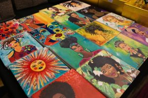 Classy Bag Lady’s Chic Boutique proprietor Connie McBride’s tile art on display at her booth at the Sacramento Black Expo on Friday, Feb. 24, 2023. McBride’s boutique is a Sacramento-based mobile fashion business that offers unique clothing, jewelry and accessories.